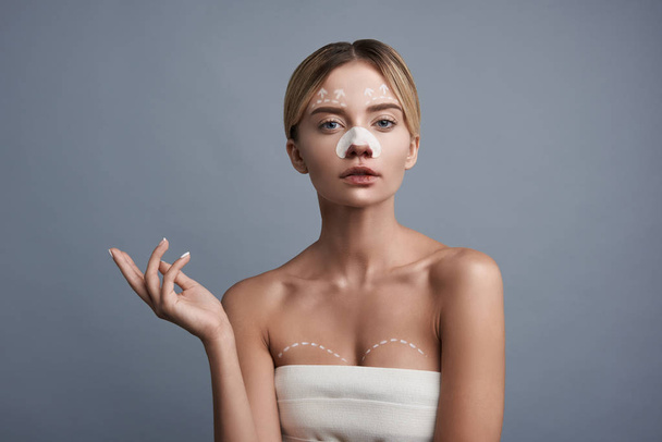 Calm woman looking confident and waiting for the plastic surgery - 写真・画像