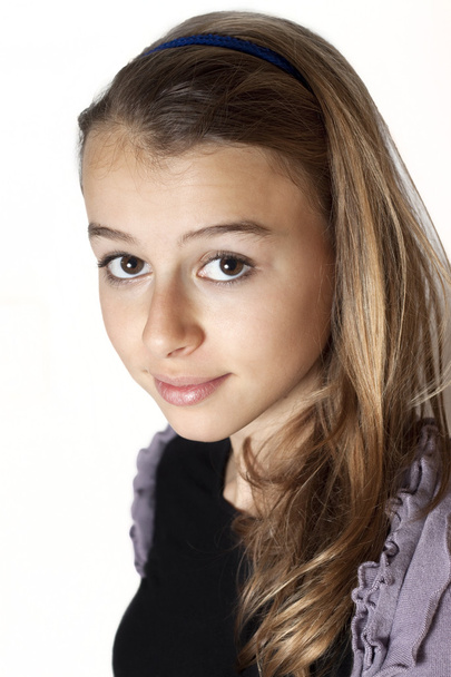 beautiful teenage girl smiling and looking into the camera. - Фото, изображение