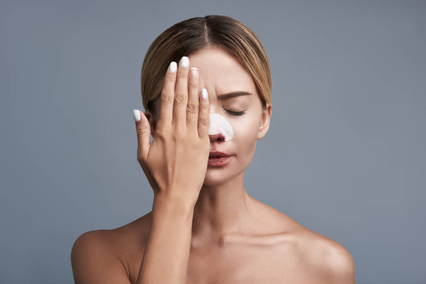 Young woman feeling terrible and closing her eye - Photo, Image