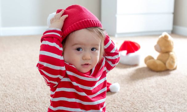 Toddler boy with a winter hat at Christmas time - Valokuva, kuva