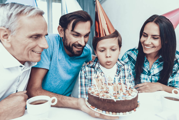 Happy Family Celebrating Father's Birthday at Home. Smiling People. Have Fun Indoor. Parenthood Concept. Usnhaved Young Man. Family at Home. Happy Family. Cake on Birthday. Candles on Cake. - Foto, Imagen