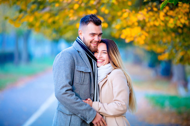 young couple in autumn season alley. Fall season - Fotografie, Obrázek