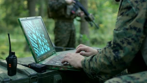 Military Operation in Action, Soldiers Using Military Grade Laptop Targeting Enemy with Satellite. In the Background Camouflaged Tent on the Forest. - Filmagem, Vídeo