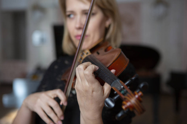 Violin player violinist classical music playing. Orchestra musical instruments Close-up portrait - Foto, Imagem