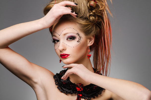 Beautiful girl with a mask and make up - Photo, Image