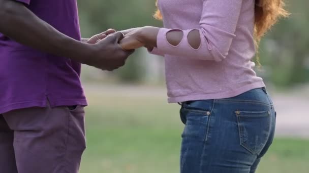 Funny jokes between young black couple in the park. Flirt,love,romance - Felvétel, videó