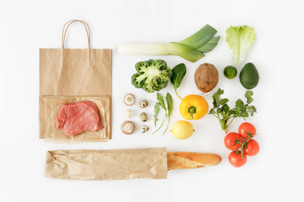 Full paper bag of different health food on white background - Foto, Imagen