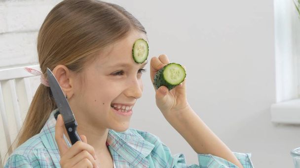 Child Eating Green Salad, Kid in Kitchen, Girl Eat Fresh Vegetable, Healthy Food - Fotó, kép