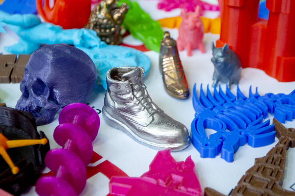 Models printed by 3d printer. Bright colorful objects printed on a 3d printer - Photo, Image