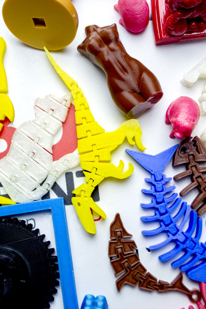 Models printed by 3d printer. Bright colorful objects printed on a 3d printer - Photo, Image