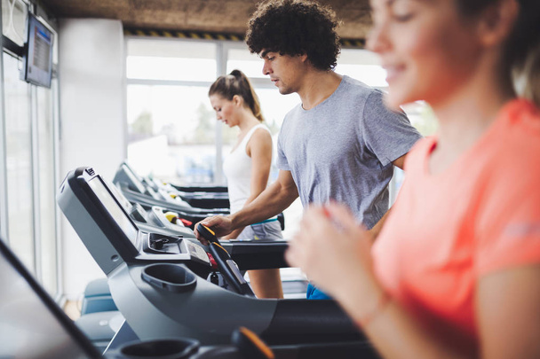 Picture of people doing cardio training on treadmill in gym - Foto, Imagem
