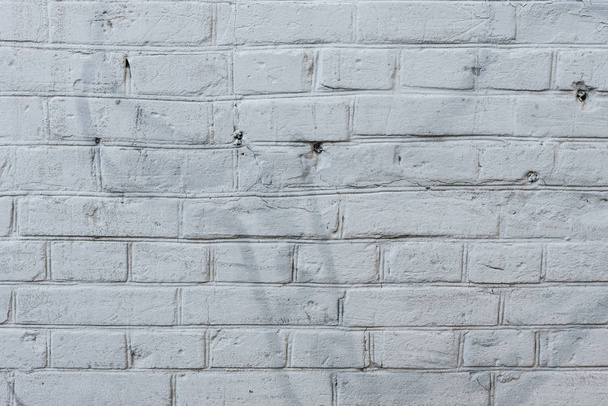 Brick texture with scratches and cracks. It can be used as a background - Photo, Image