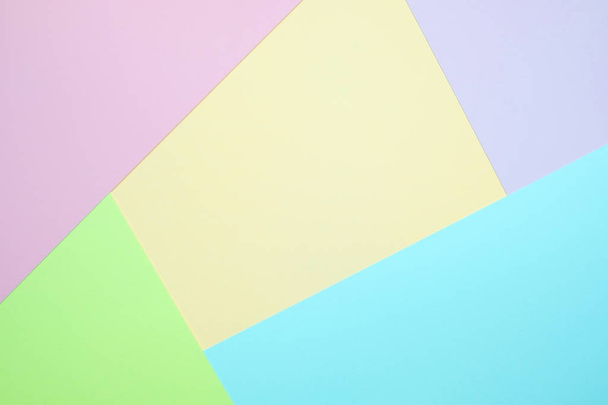 Fashionable  pastel colored paper flat lay top view, geometric background texture, pink, purple, yellow, beige, green and blue colour. - 写真・画像