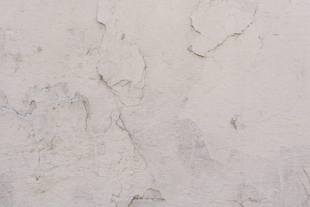 Wall fragment with scratches and cracks. It can be used as a background - Fotó, kép