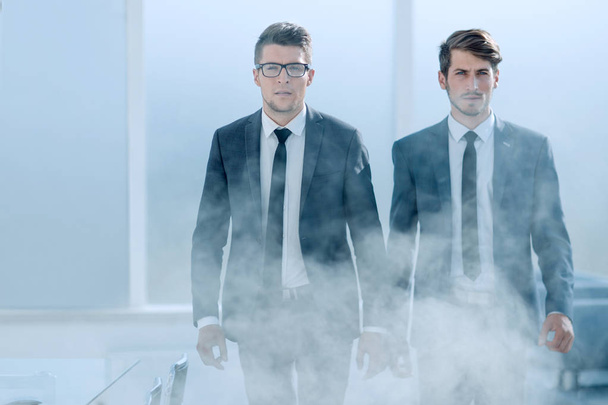 young business people in a smoky office - Photo, Image