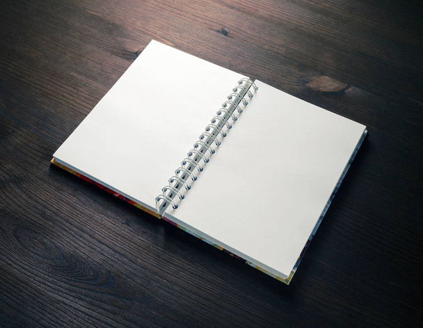 Blank notebook on wood table background. Spiral notepad. Mockup for your design. - Foto, Bild