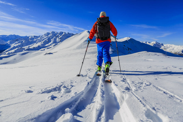 Ski with amazing view of swiss famous mountains in beautiful winter snow Mt Fort. The skituring, backcountry skiing in fresh powder snow. - Photo, Image