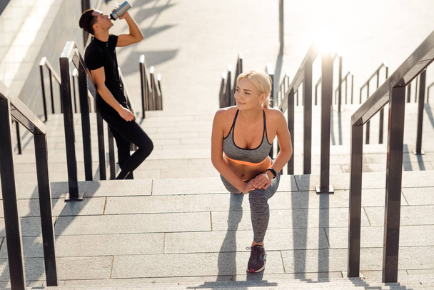 Man and woman training outdoors - Photo, Image