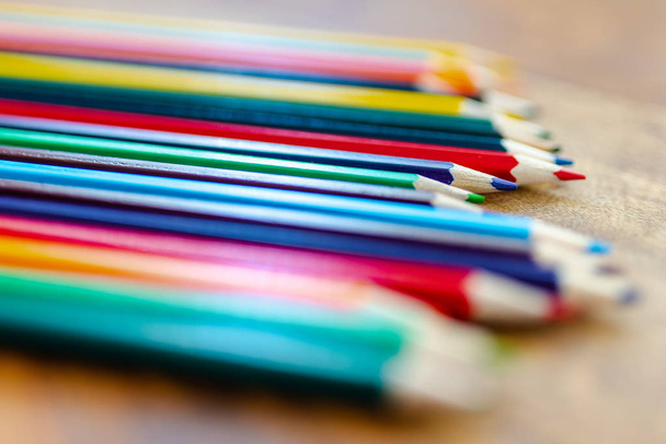 colored pencils on wooden desk - Foto, immagini