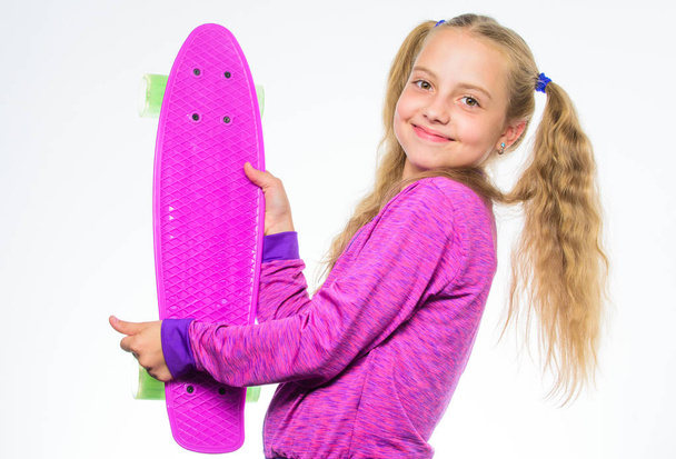 Plastic skateboards for everyday skater. Child hold penny board. Penny board of her dream. Best gifts for kids. Ultimate gift list help pick perfect present for girl. Kid long hair carry penny board - 写真・画像