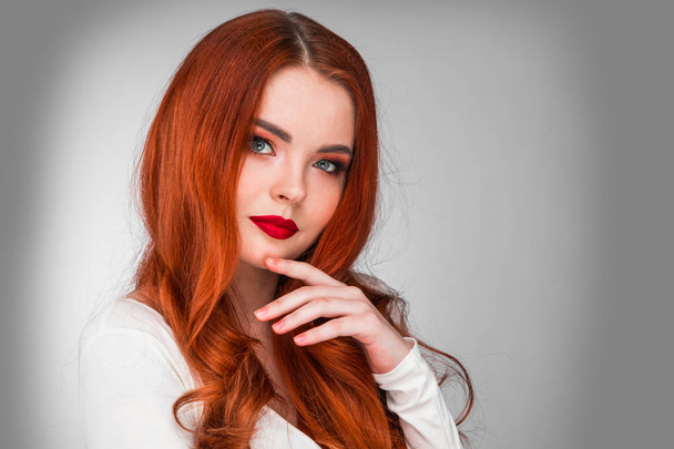 Photoshot of gorgeous redhead girl with bright makeup - Фото, изображение
