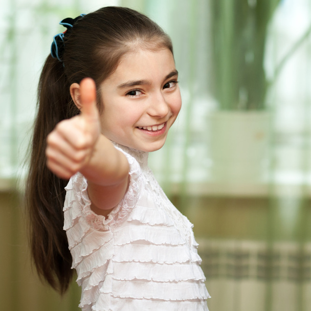 girl showing thumbs up - 写真・画像