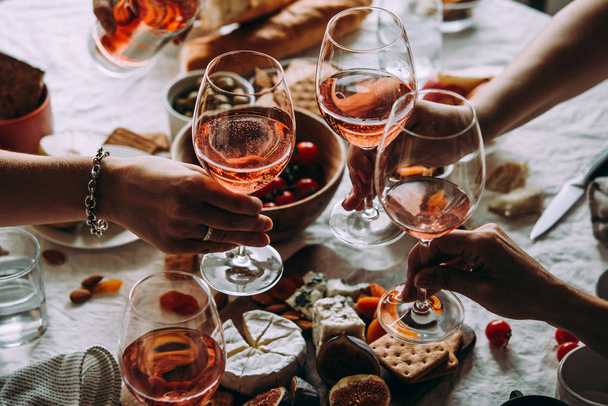 Glasses of rose wine seen during a friendly party of a celebration. - Foto, imagen