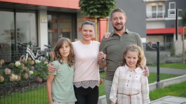 Happy Family Near Their New House. Real Estate Concept. They Have A Lot of Fun Together. HD, Outdoor, Portrait. - Кадри, відео