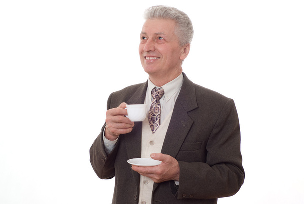 Businessman drinking from a cup - Zdjęcie, obraz