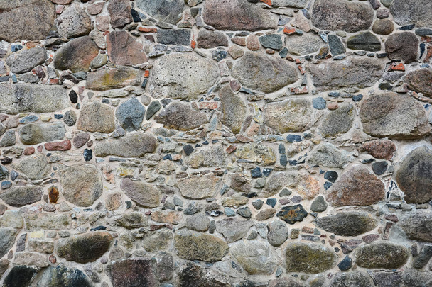 Mur de pierre du vieux château de rochers de granit, ancienne maçonnerie. Texture, pierre
. - Photo, image