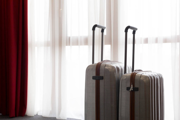 Suitcase or luggage bag in a modern hotel room - Fotó, kép