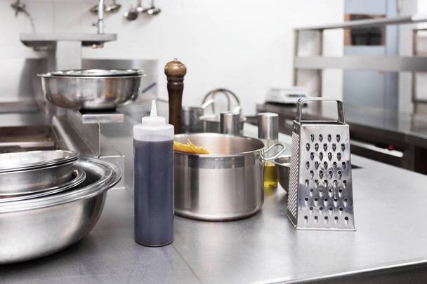 Metal dishes in a restaurant kitchen - Фото, зображення