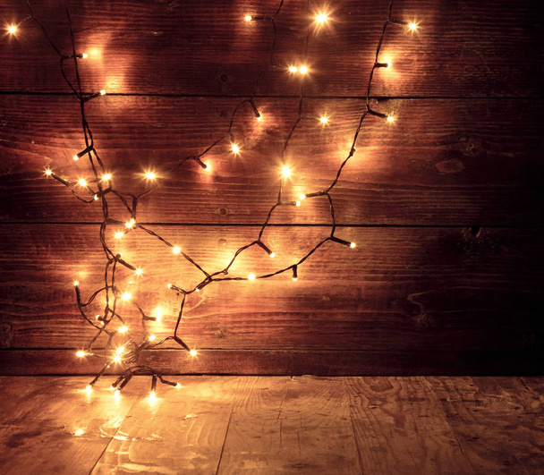 christmas lights on wooden background - Photo, Image