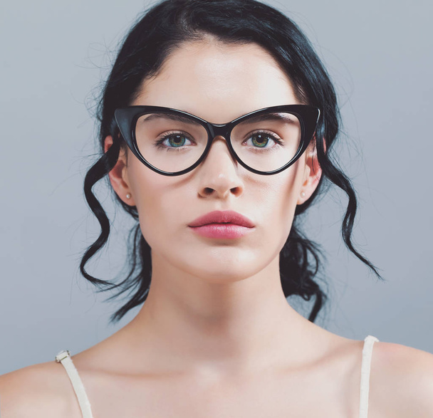 Young woman with eye glasses - Fotó, kép
