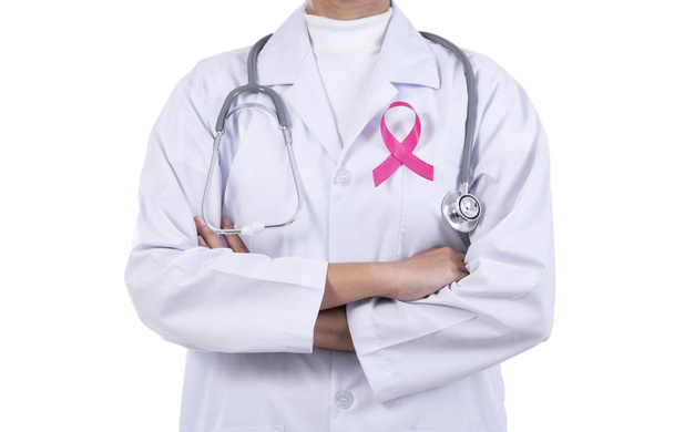 Doctor woman with pink ribbon on her chest, supporting symbol of breast cancer awareness and international women day campaign. - Photo, image