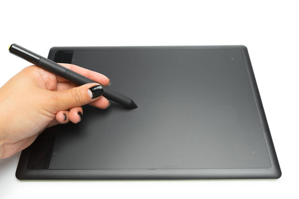 Graphic tablet with pen and hand for illustrators and designers, isolated on white background - Photo, image