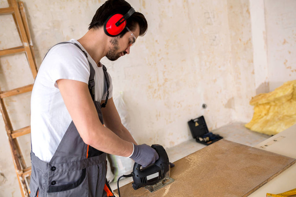 Experienced and skillful handyman makes carpentry work look really easy  - Fotó, kép