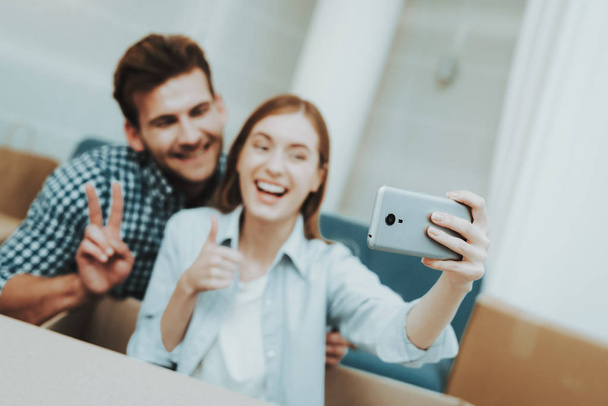 Young Couple Doing Selfie. New Apartment Concept. Holiday Leisure. Happy Family Weekend Joy. Love Each Other. Newlyweds In A New Housing. Relocation In A Flat. Cheerful Sweethearts. - Foto, Imagem