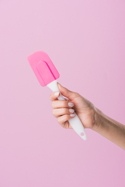 cropped shot of woman holding spatula isolated on pink - Fotografie, Obrázek