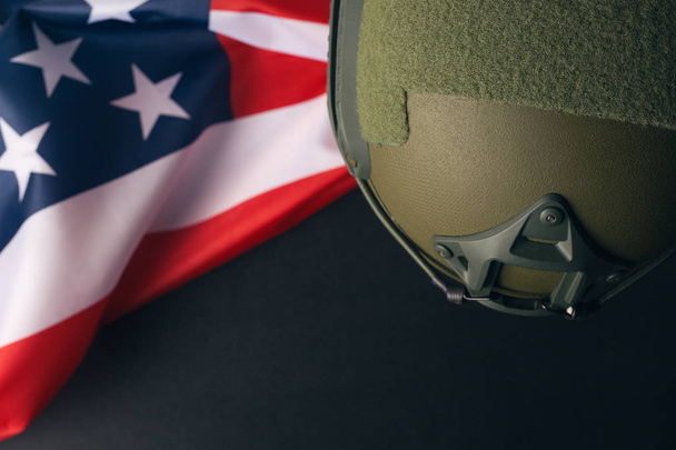 Military helmets and American flag on background - Foto, Imagen