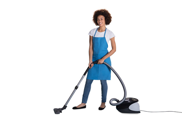 Portrait Of Happy Female Janitor With Vacuum Cleaner On White Background - Foto, Bild