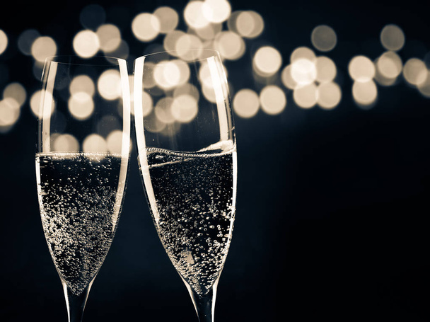 two champagne glasses ready to bring in the New Year - Fotoğraf, Görsel