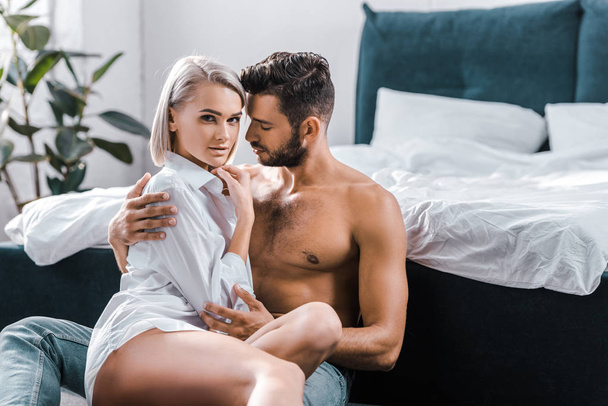 passionate sexy couple cuddling in bedroom - Fotó, kép