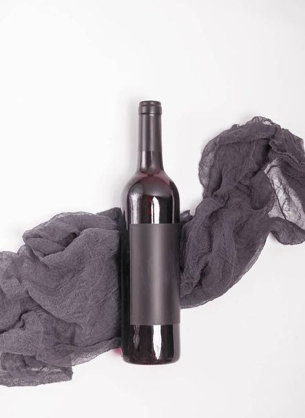 A bottle of the red wine on the white background - Fotografie, Obrázek