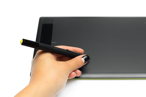 Graphic tablet with pen and hand for illustrators and designers, isolated on white background - Fotó, kép