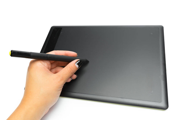 Graphic tablet with pen and hand for illustrators and designers, isolated on white background - Foto, imagen