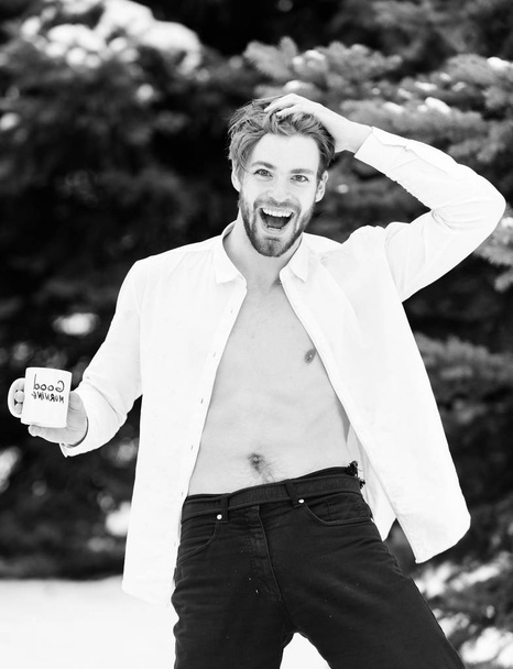 handsome sexy man with morning cup in winter outdoor - 写真・画像