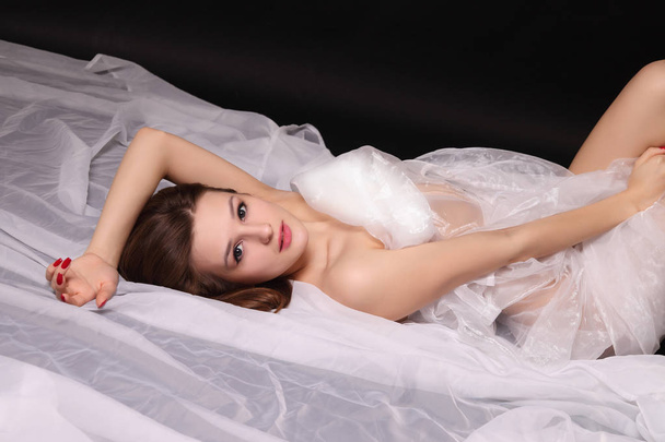 young sexy girl covered in white cloth - Photo, Image