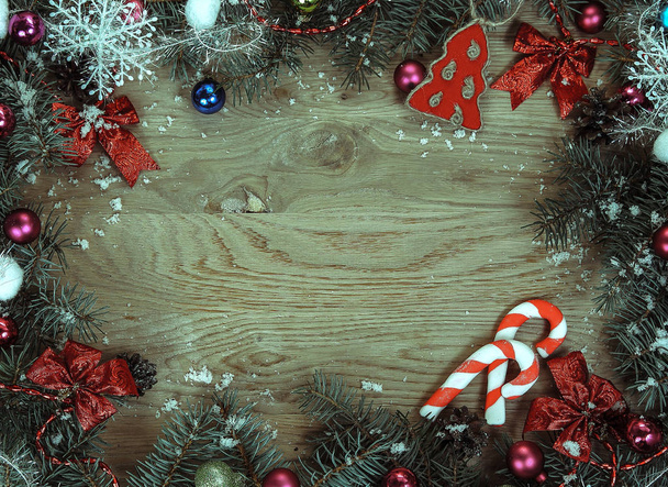 Christmas card. Christmas wreath on wooden background . - Фото, изображение