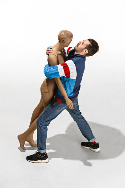 Fashion woman body. The man hugging mannequin, perfect woman dream concept - Фото, зображення